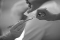 A dentist takes a disposable swab with tweezers